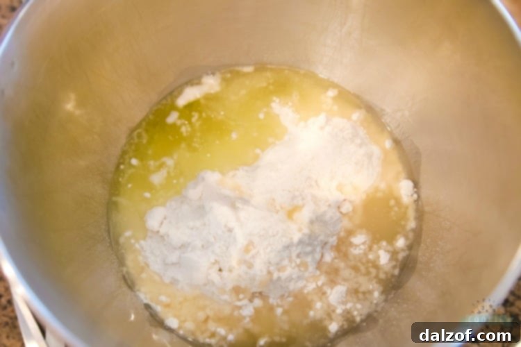 Preparing white cake mix cookie batter for baking