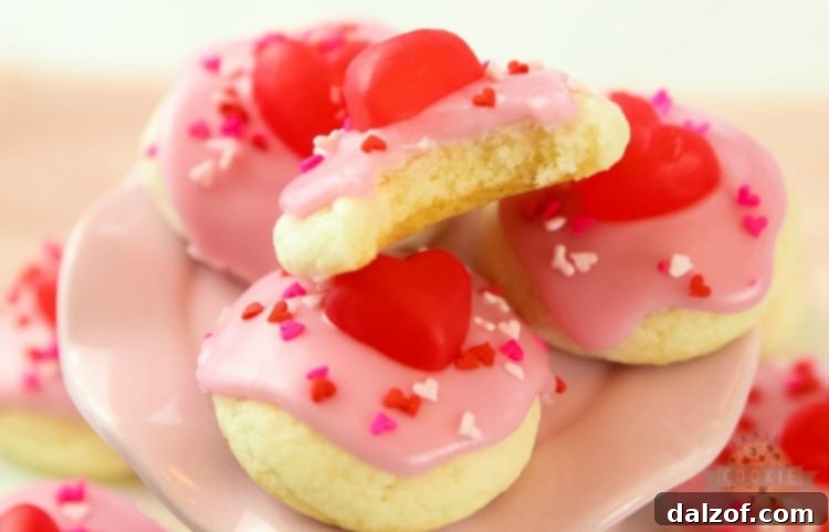 Close-up of Valentines Cake Mix Cookies decorated with icing and sprinkles