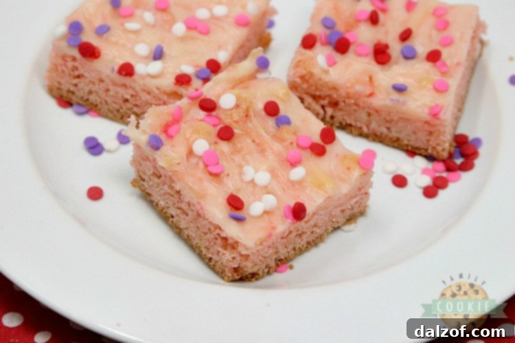 Strawberry cookie bars with swirled cream cheese filling