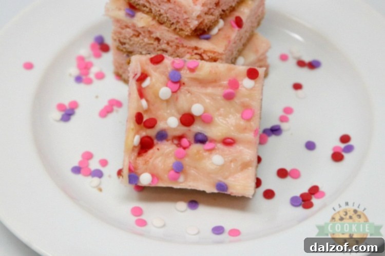 Strawberry cookie bars with swirled cream cheese filling