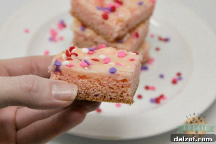 Strawberry cookie bars with swirled cream cheese filling