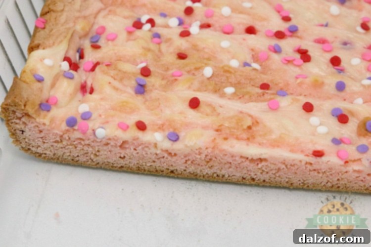 Strawberry cookie bars with swirled cream cheese filling