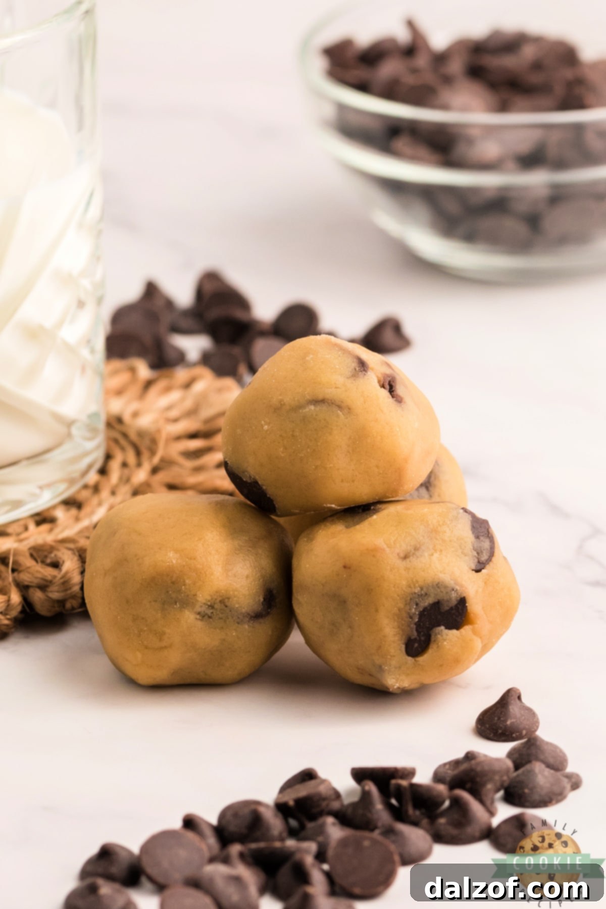 Chocolate Chip Cookie Dough Bites are the ultimate way to enjoy eating raw cookie dough, without worrying about the uncooked egg and flour. Edible chocolate chip cookie dough that is safe to eat, and perfectly portioned for a quick treat!