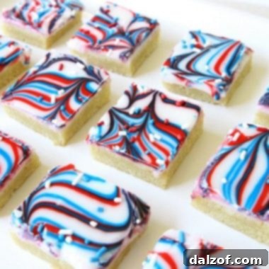 Patriotic Cookie Bars with swirled red, white & blue icing, a festive sugar cookie bar recipe.