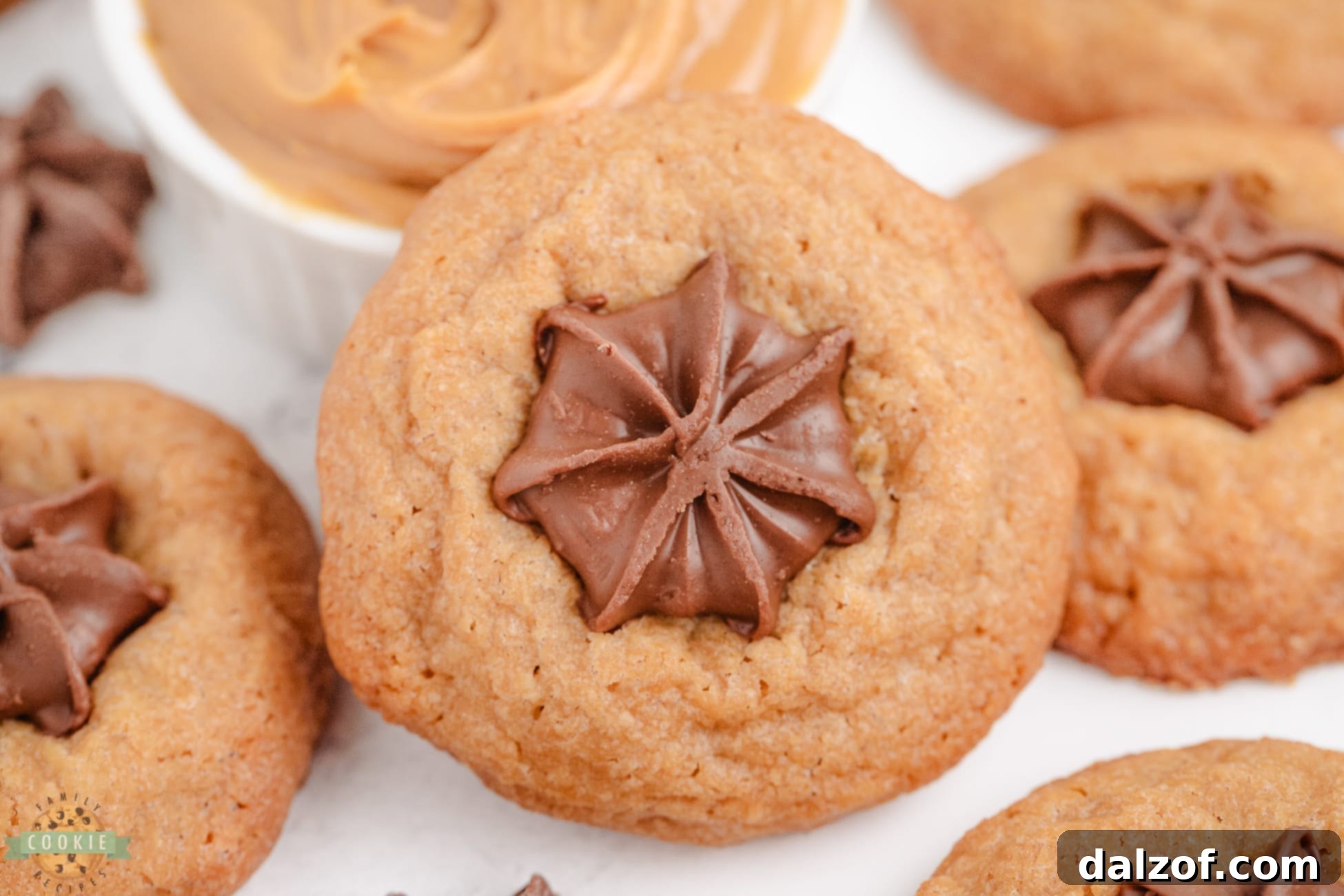 Easiest ever Peanut Butter Kiss Cookies recipe, featuring a classic, soft, and chewy texture with a chocolate topping.
