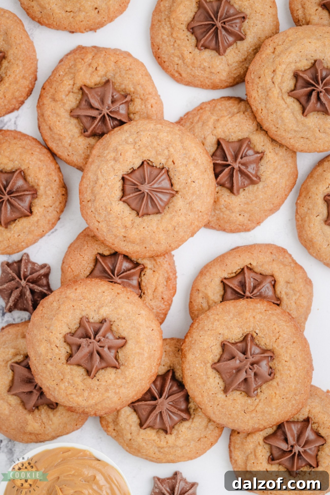 Easy peanut butter kiss cookies, perfectly baked with a molten chocolate star in the center, ready to enjoy.
