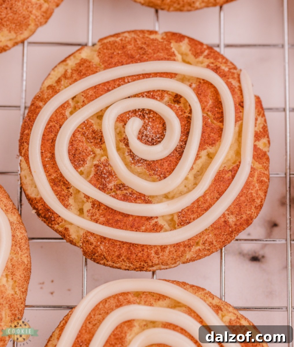 vanilla swirled icing on a snickerdoodle