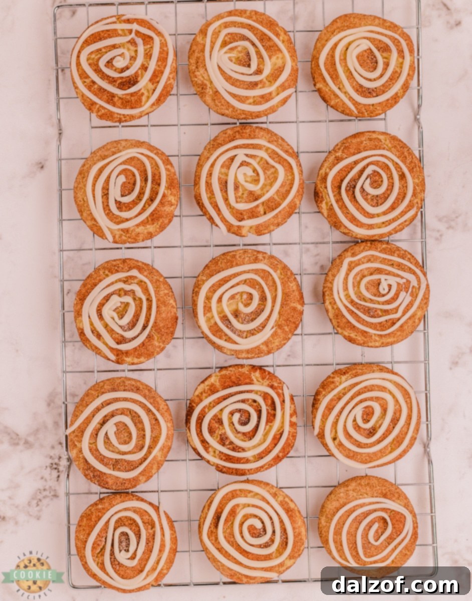 cinnamon roll snickerdoodles on a cooling rack