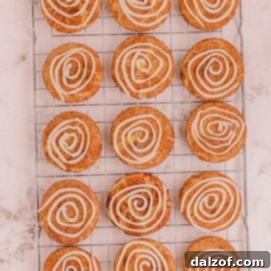 cinnamon roll snickerdoodles on a cooling rack