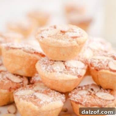 Dutch Almond Cookie Cups dusted with powdered sugar