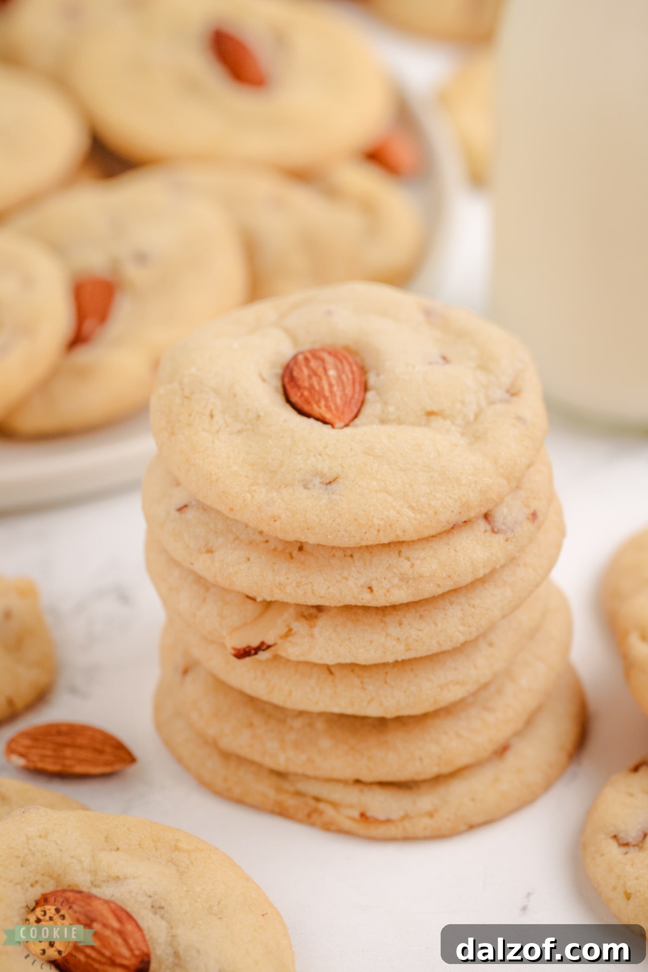 A stack of golden-brown almond drop cookies, inviting and ready to be eaten.