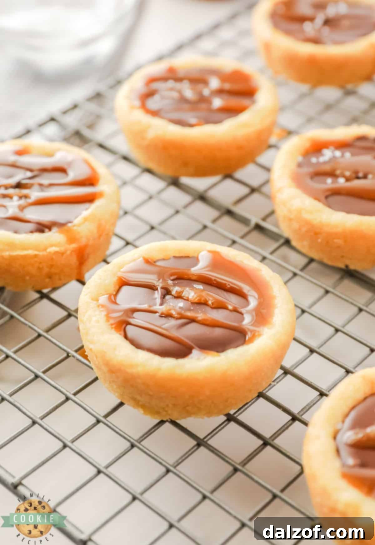 Sugar cookie cup filled with chocolate and caramel.