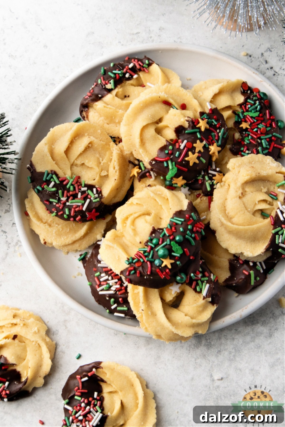 Plate of butter cookies with red and green sprinkles.