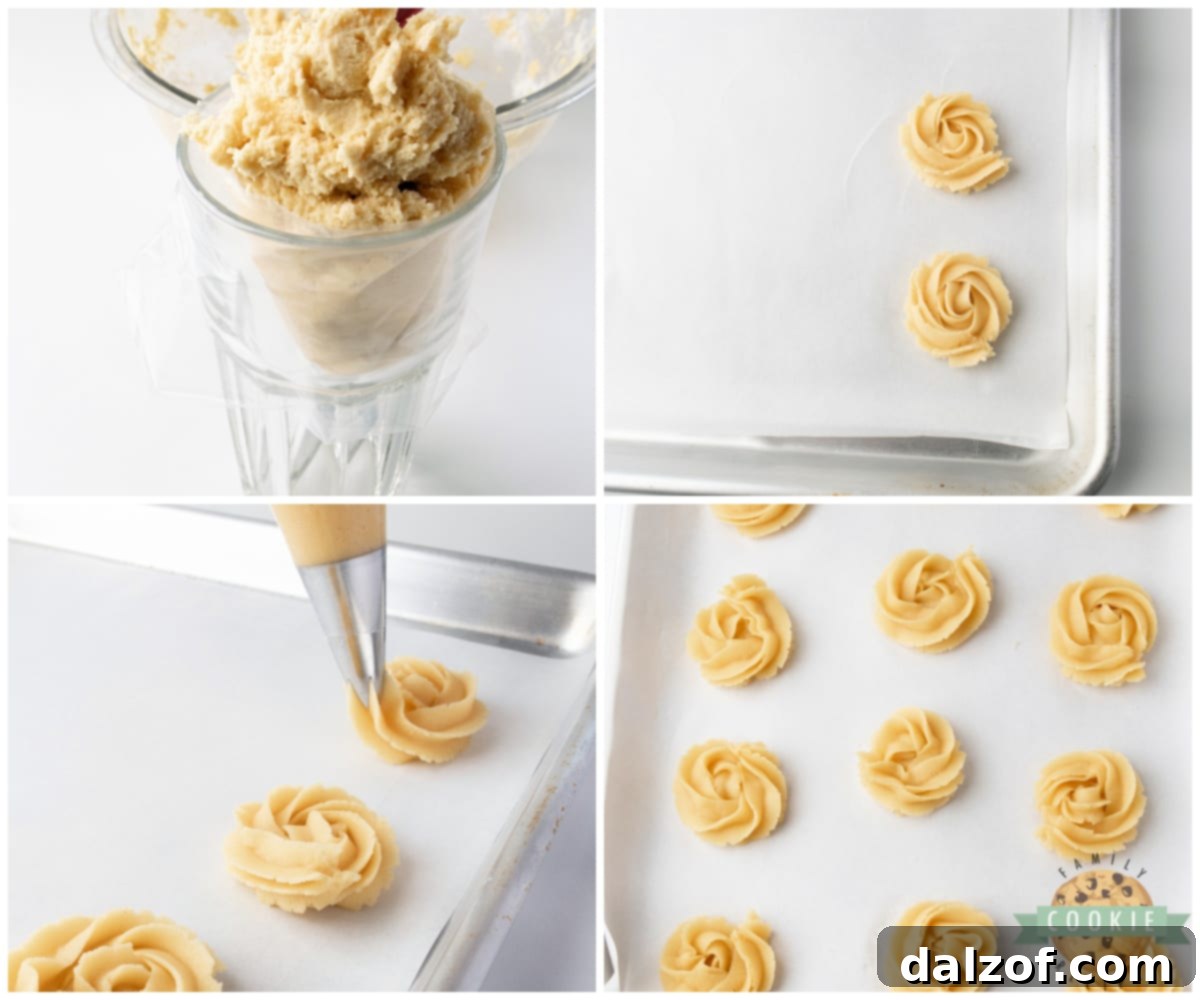 Piping butter cookies onto parchment paper.