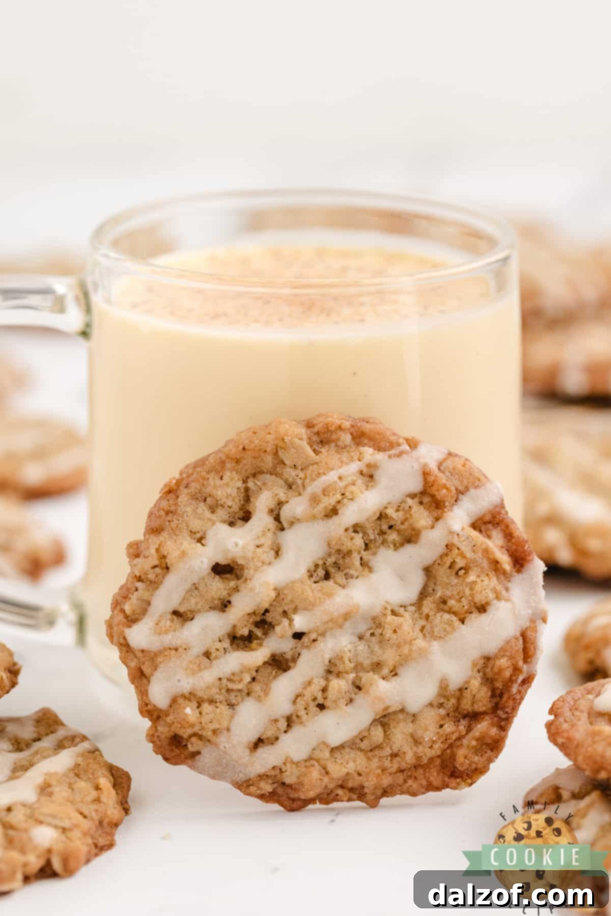Oatmeal cookie and a glass of eggnog.