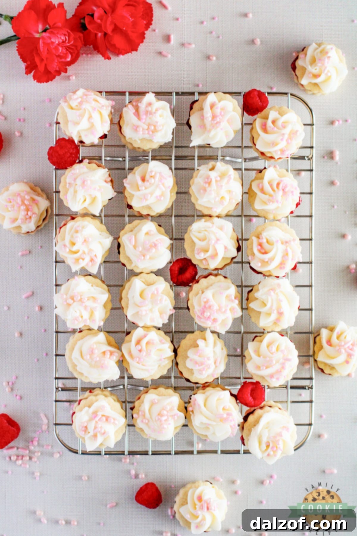 Empire cookies frosted with buttercream and sprinkles.