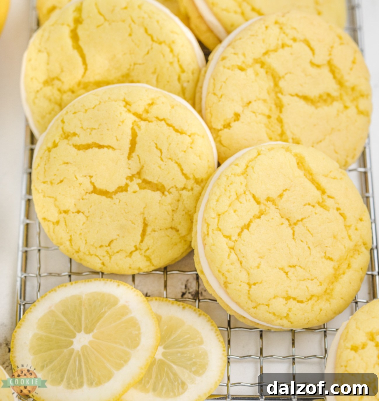 Zesty Lemon Oreo Cake Mix Cookies 2 Freshly baked lemon oreo cake mix cookies cooling on a wire rack, ready for their delicious lemon cream cheese filling.