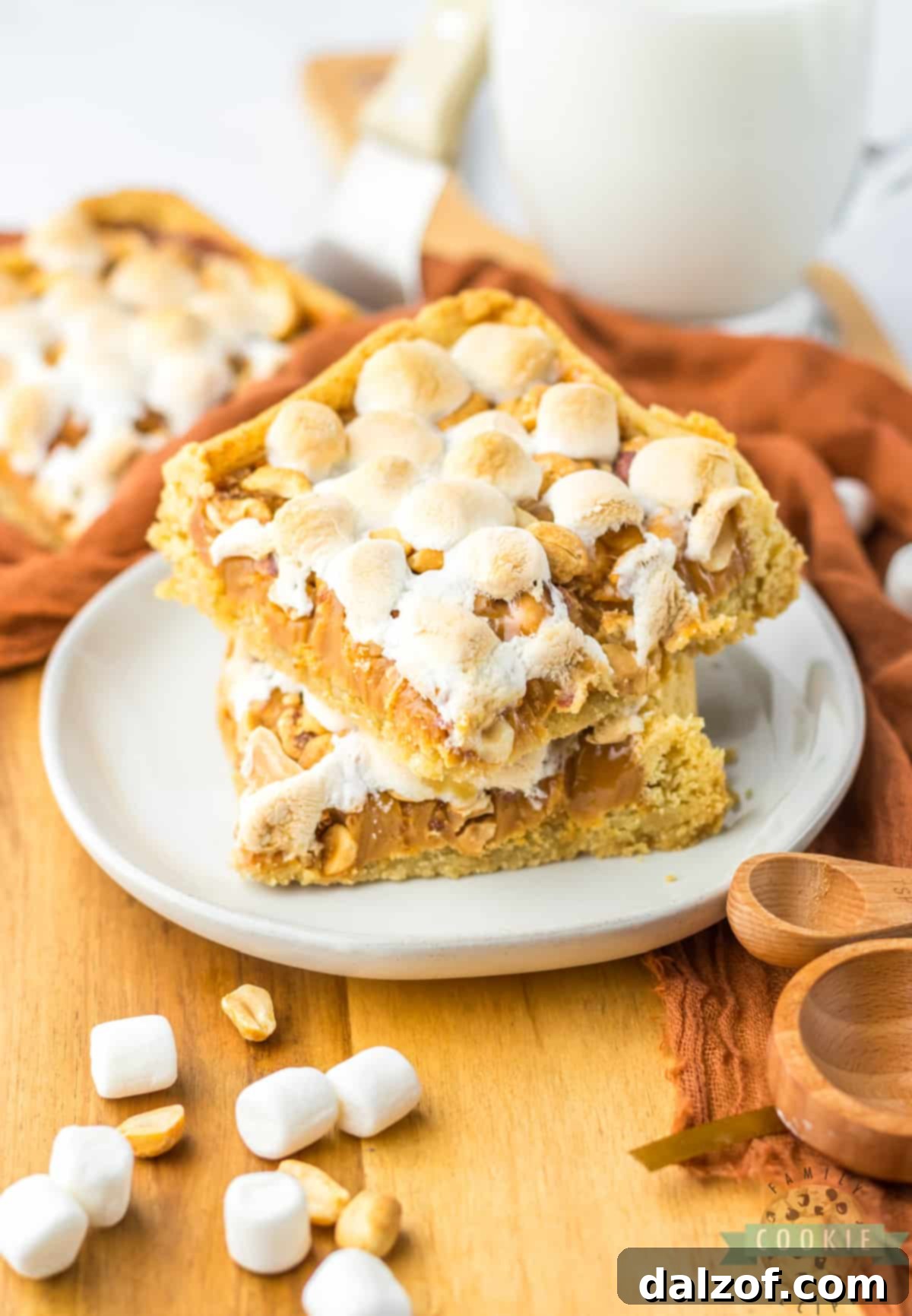 Easy Peanut Caramel Cookie Bars are made with only 5 ingredients! Chewy cookie bar recipe made with a sugar cookie crust that is topped with melted caramel, peanuts and marshmallows. 