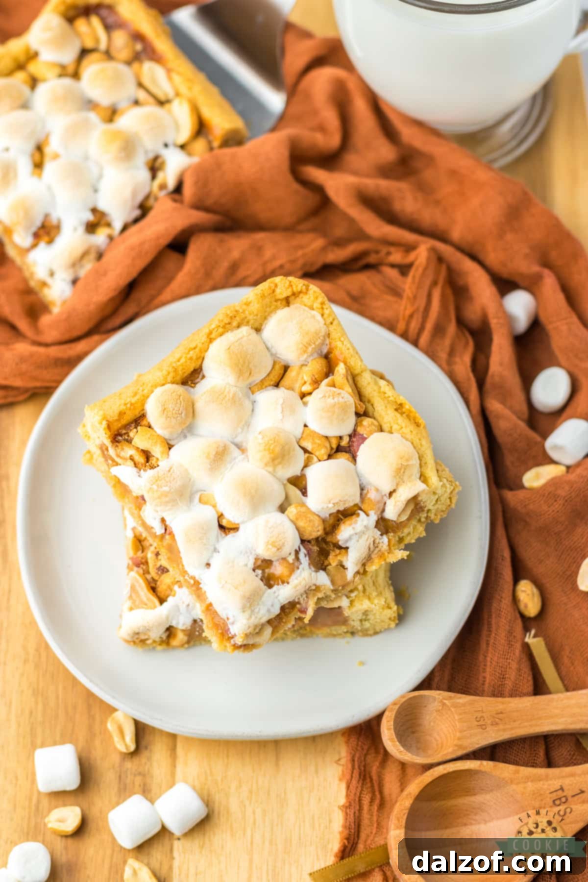 Stack of cookie bars made with caramel and peanuts. 