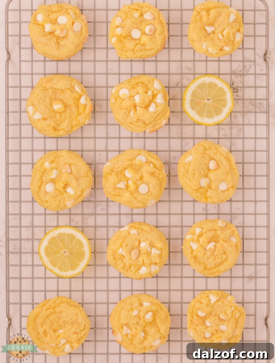 Lemon cream cookies on a cooling rack, fresh out of the oven