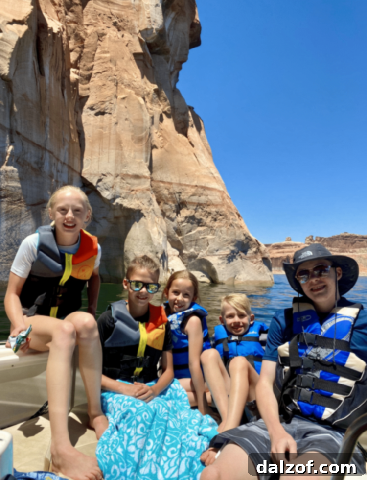 Scenic view of Lake Powell with dramatic rock formations, a perfect setting for family relaxation.