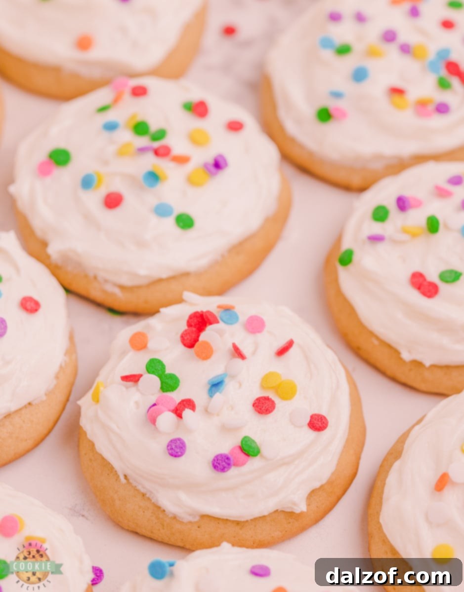 Baked buttermilk sugar cookies on a baking sheet.