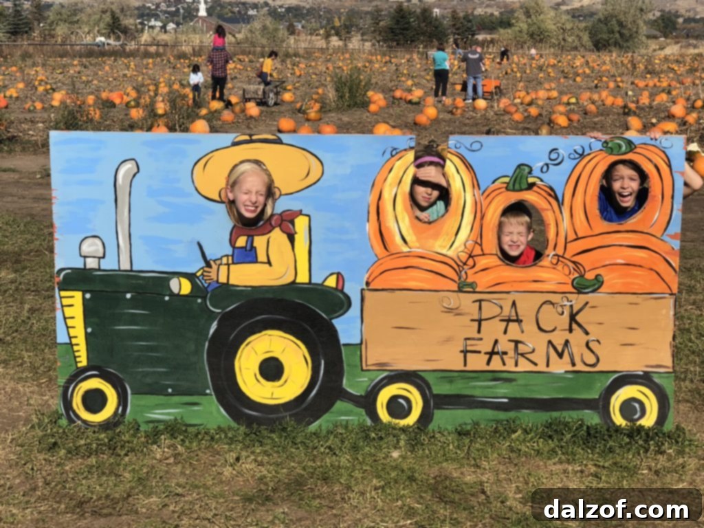 Children happily posing with their pumpkins at a sunny pumpkin patch, capturing a fun family memory.