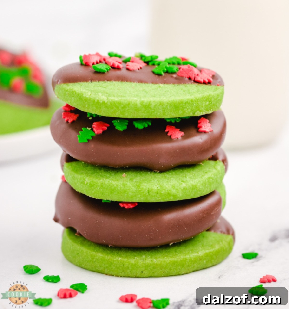 A charming stack of homemade mint chocolate Christmas cookies on a festive plate, ready for sharing.