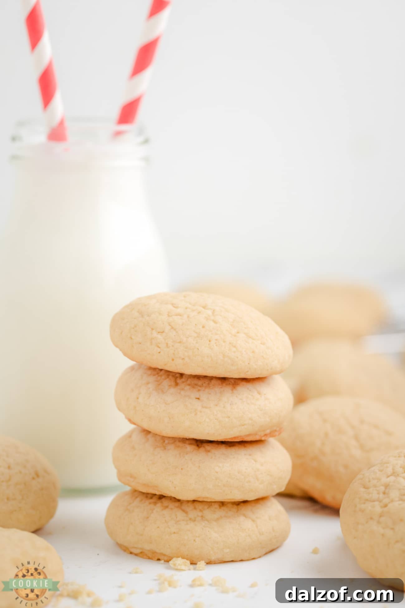 stack of homemade copycat Nilla wafer cookies with a glass of milk