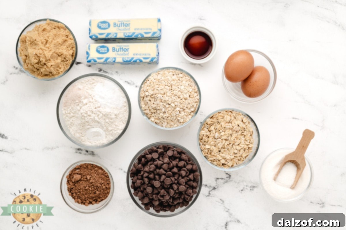 All the dry and wet ingredients for Double Chocolate Oatmeal Cookies laid out on a kitchen counter, ready for mixing.