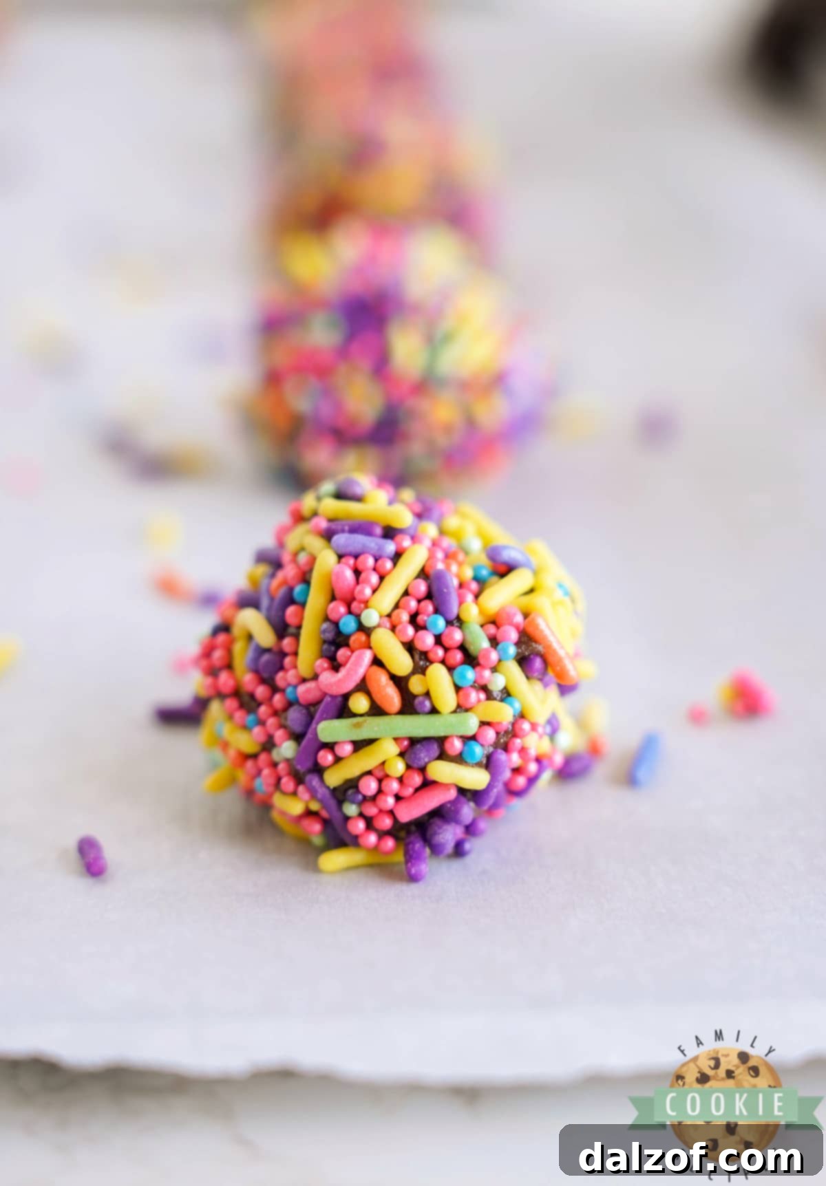 Sprinkle coated brownie cookie dough ready to bake. 