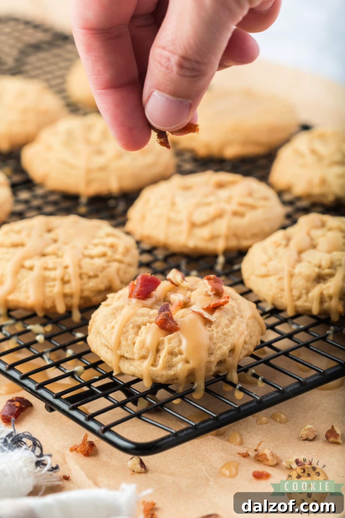 Sweet and Salty Maple Bacon Cookies 10 Adding crumbled bacon and nuts to the top of the cooled cookies.