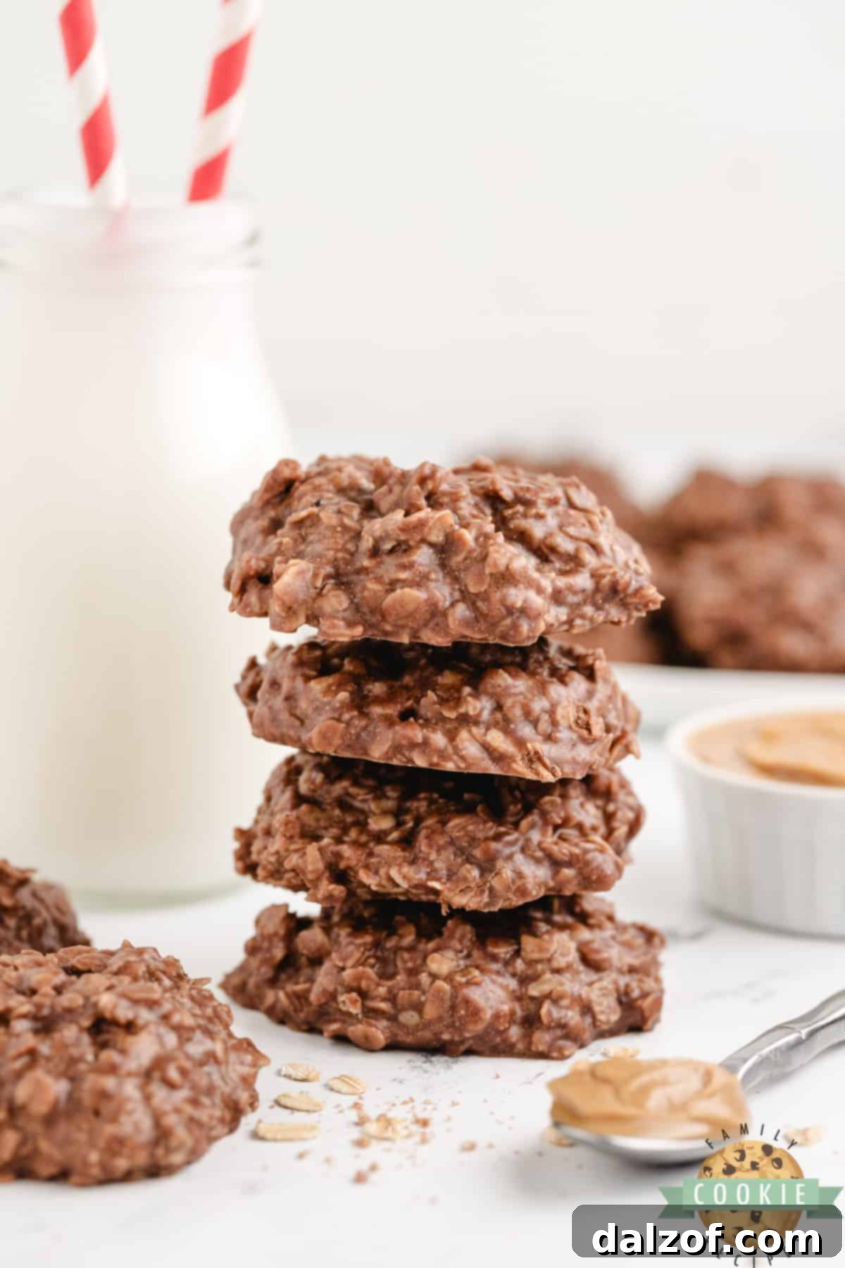 A mouth-watering stack of chocolate peanut butter oat cookies, showcasing their inviting texture and rich color, ready to be enjoyed.