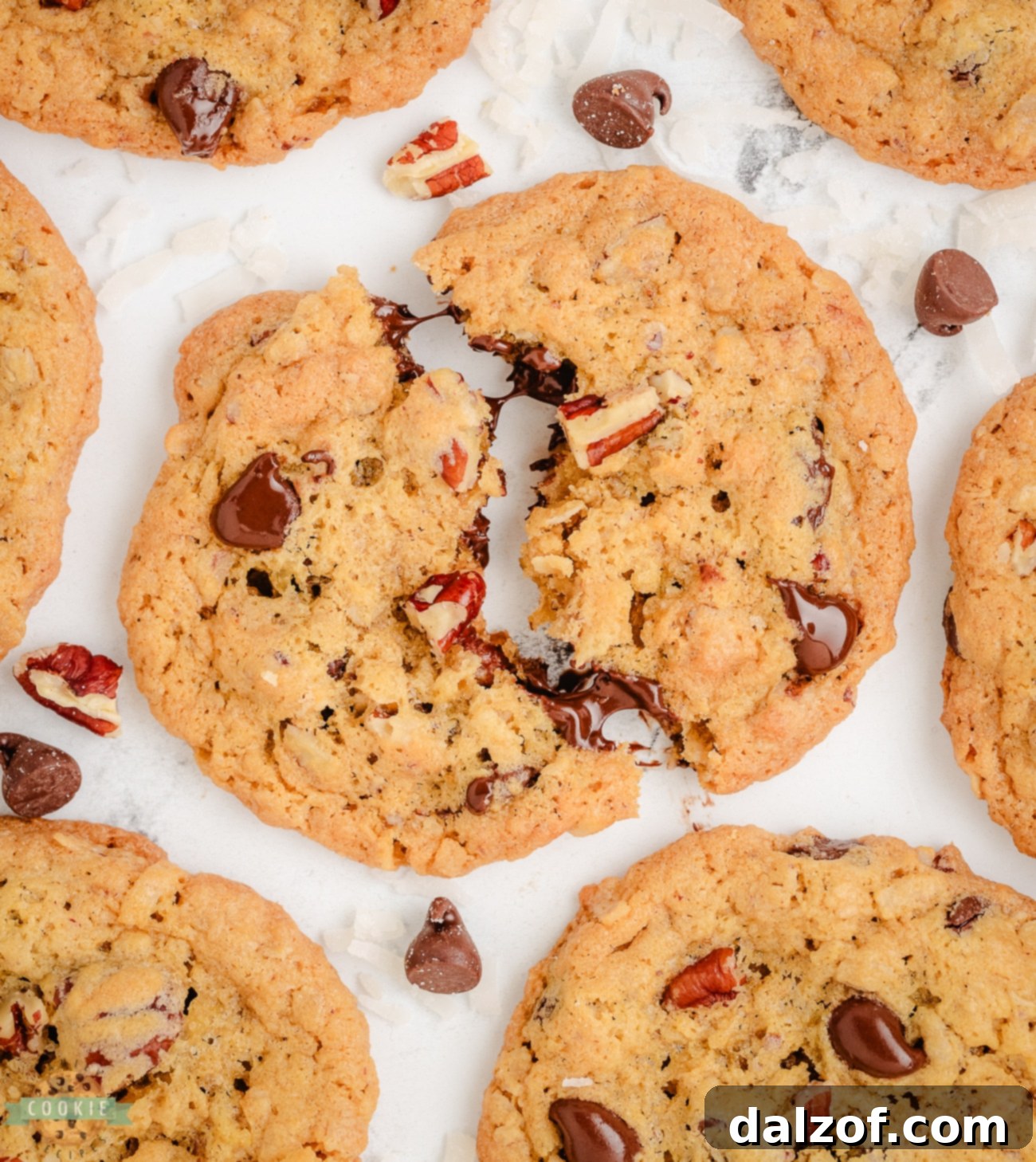 A 10-cup cookie broken in half, revealing its rich, loaded interior