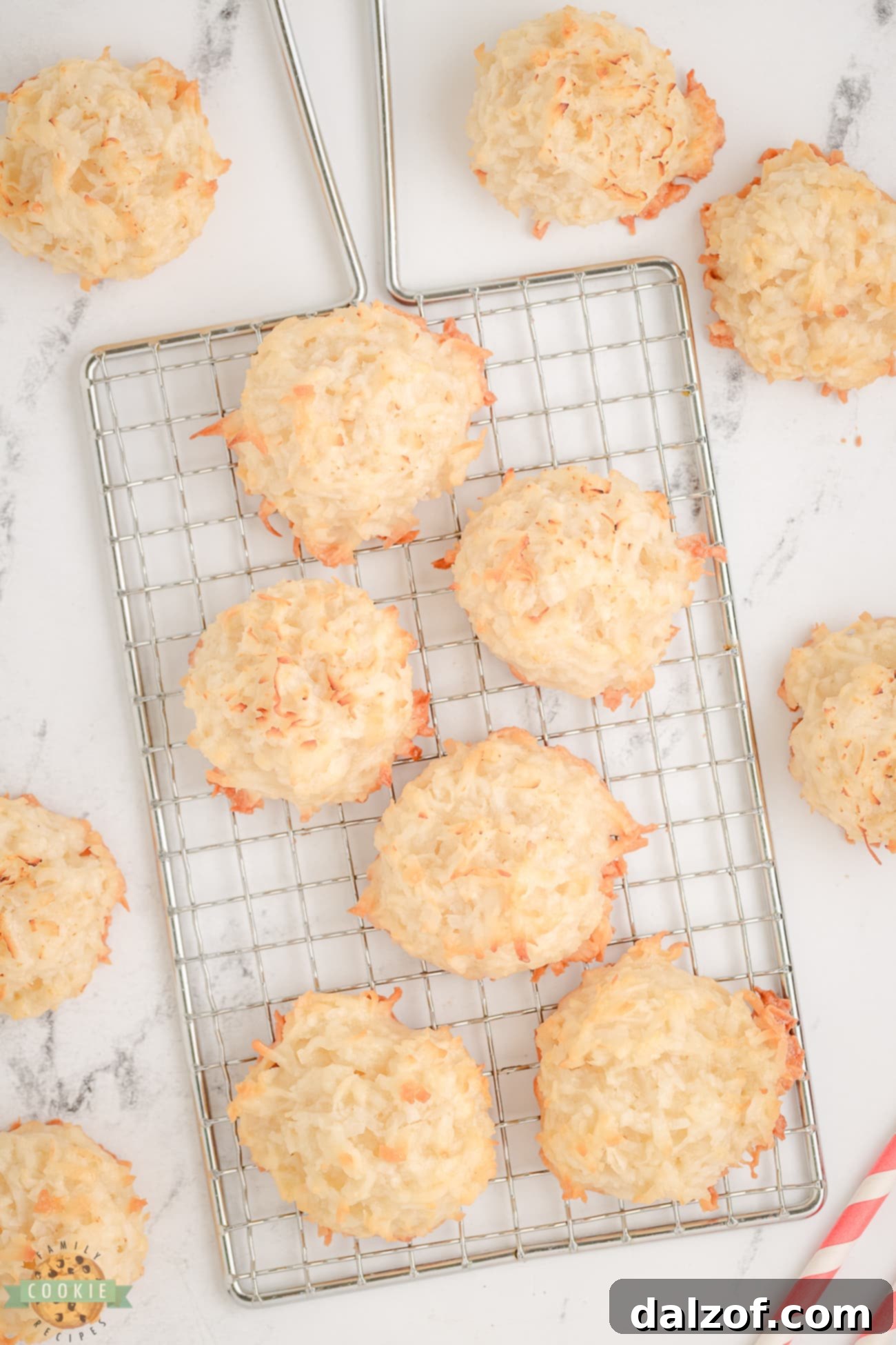 Freshly baked coconut macaroons resting on a wire cooling rack, ready to be enjoyed.
