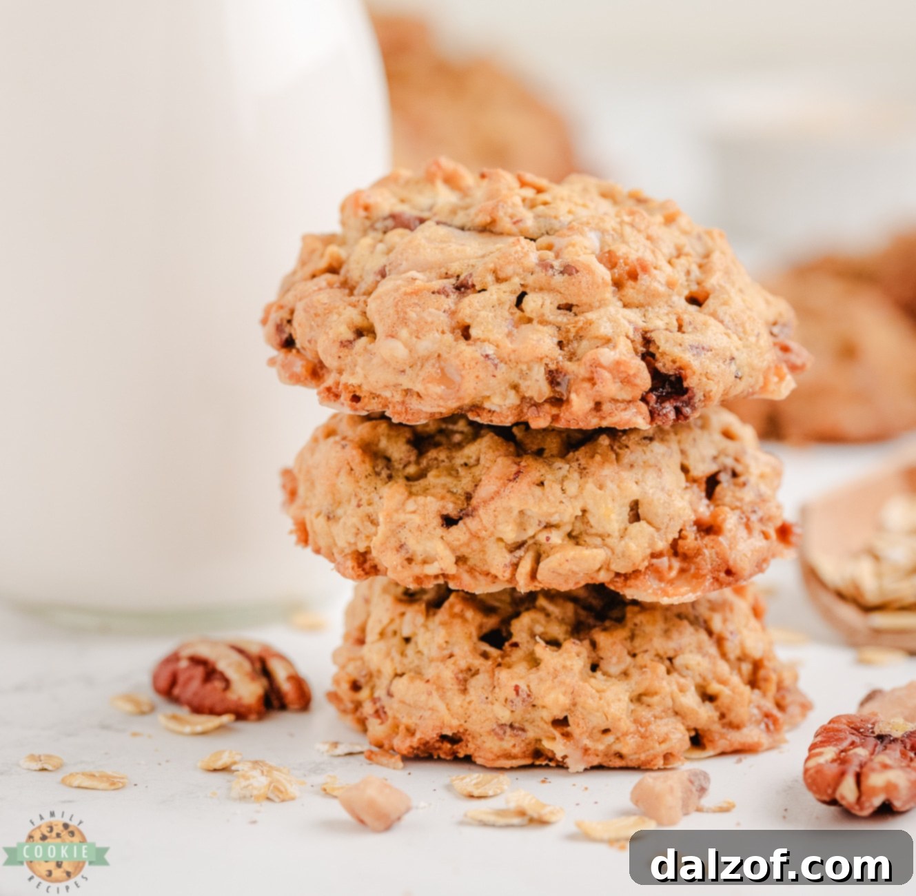 A stack of golden-brown oatmeal toffee pecan cookies, ready to be enjoyed as a comforting dessert