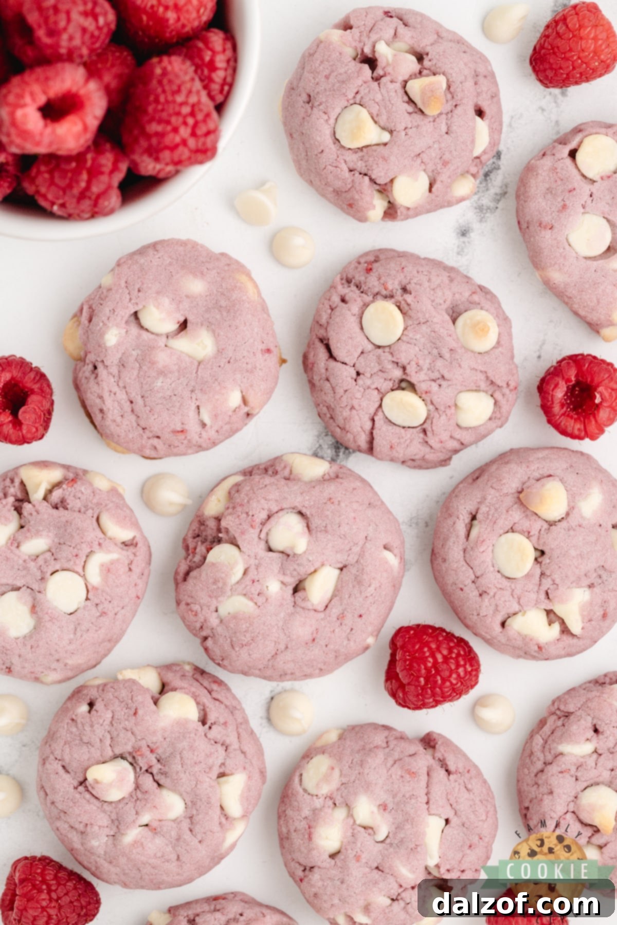 A beautifully composed shot of freshly baked Raspberry Cookies with White Chocolate Chips, highlighting their vibrant color and inviting texture.