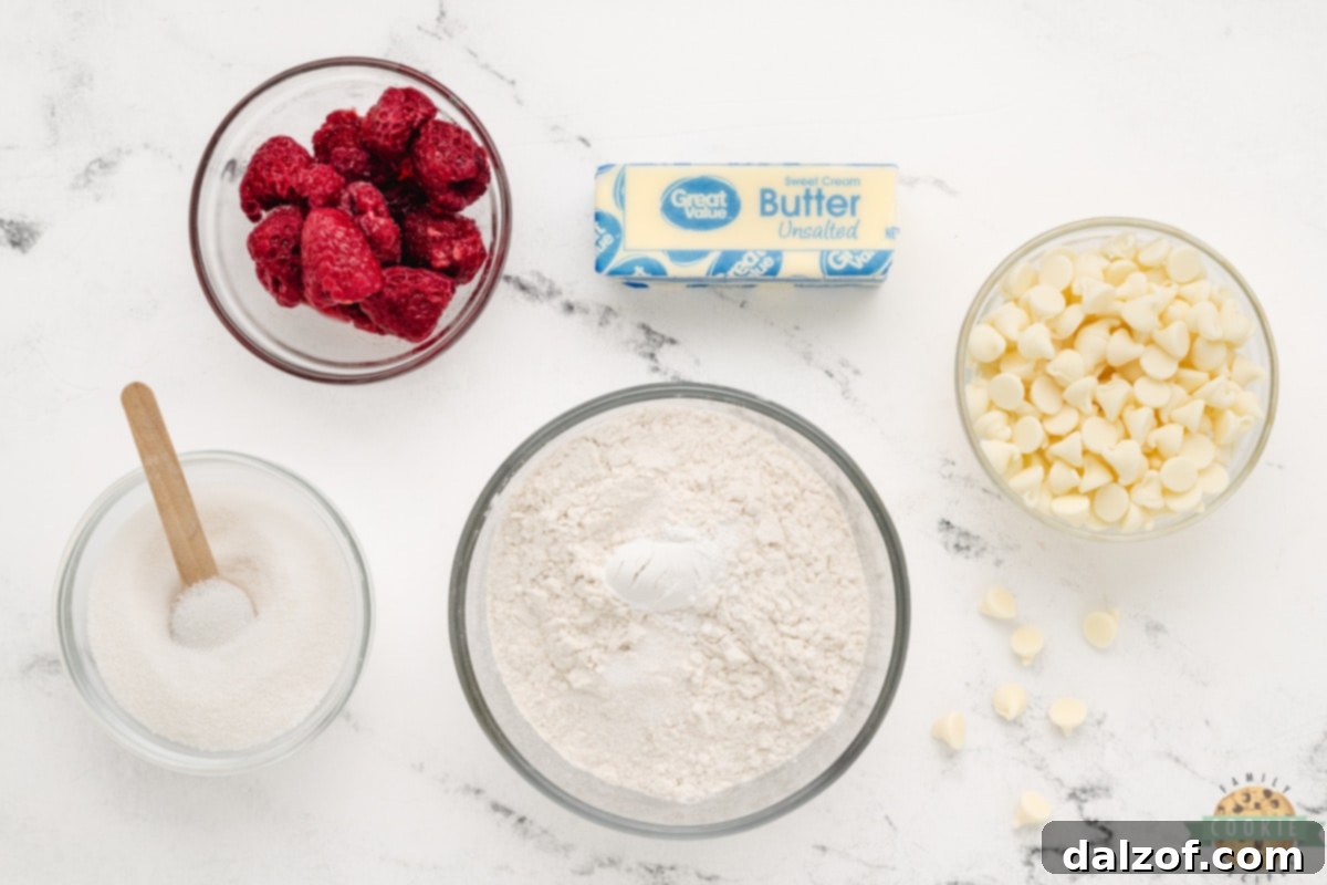 A visual display of the key ingredients required to bake delicious Raspberry Cookies, neatly arranged for clarity.
