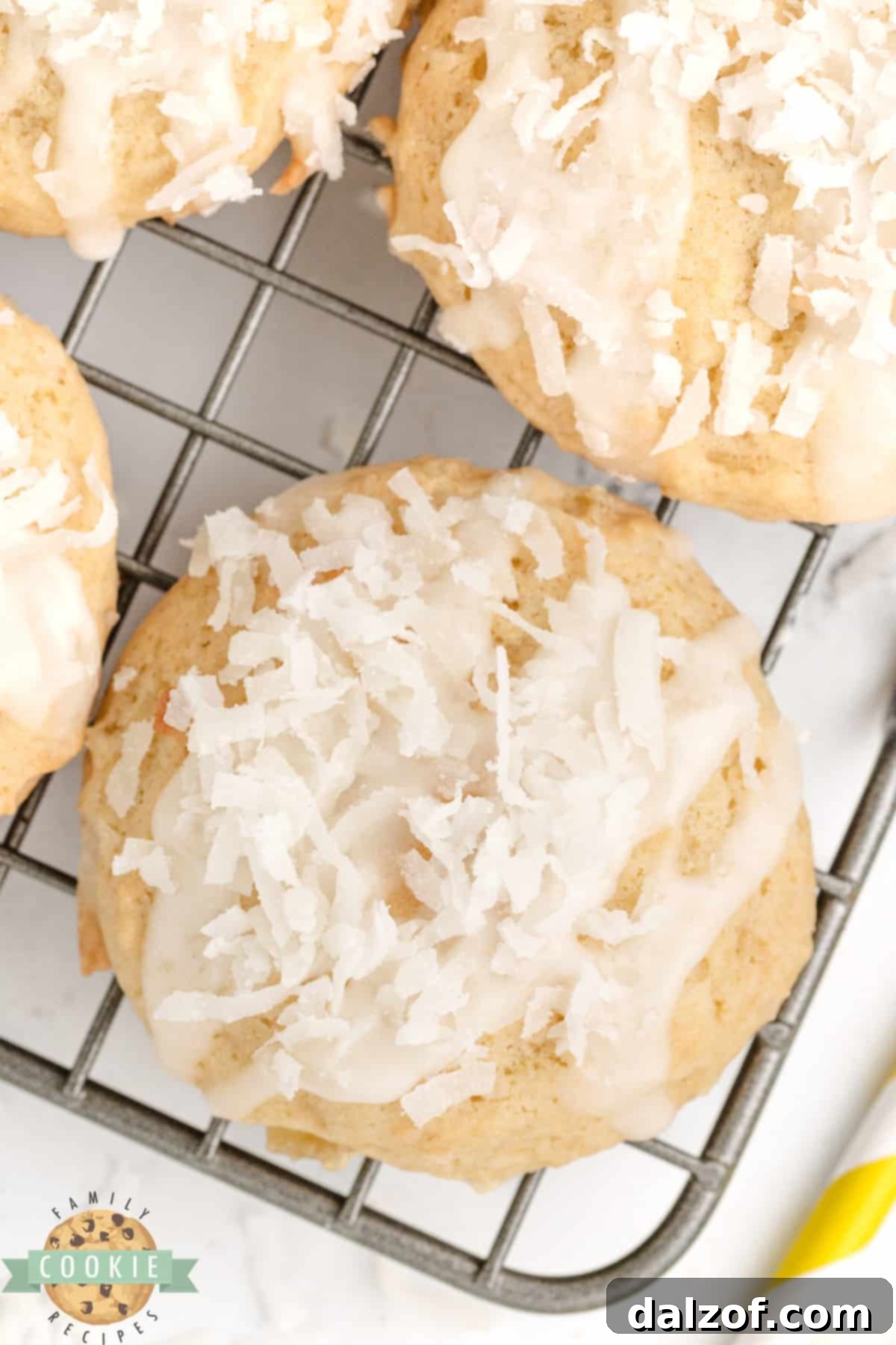 Cookie topped with pineapple glaze and shredded coconut. 