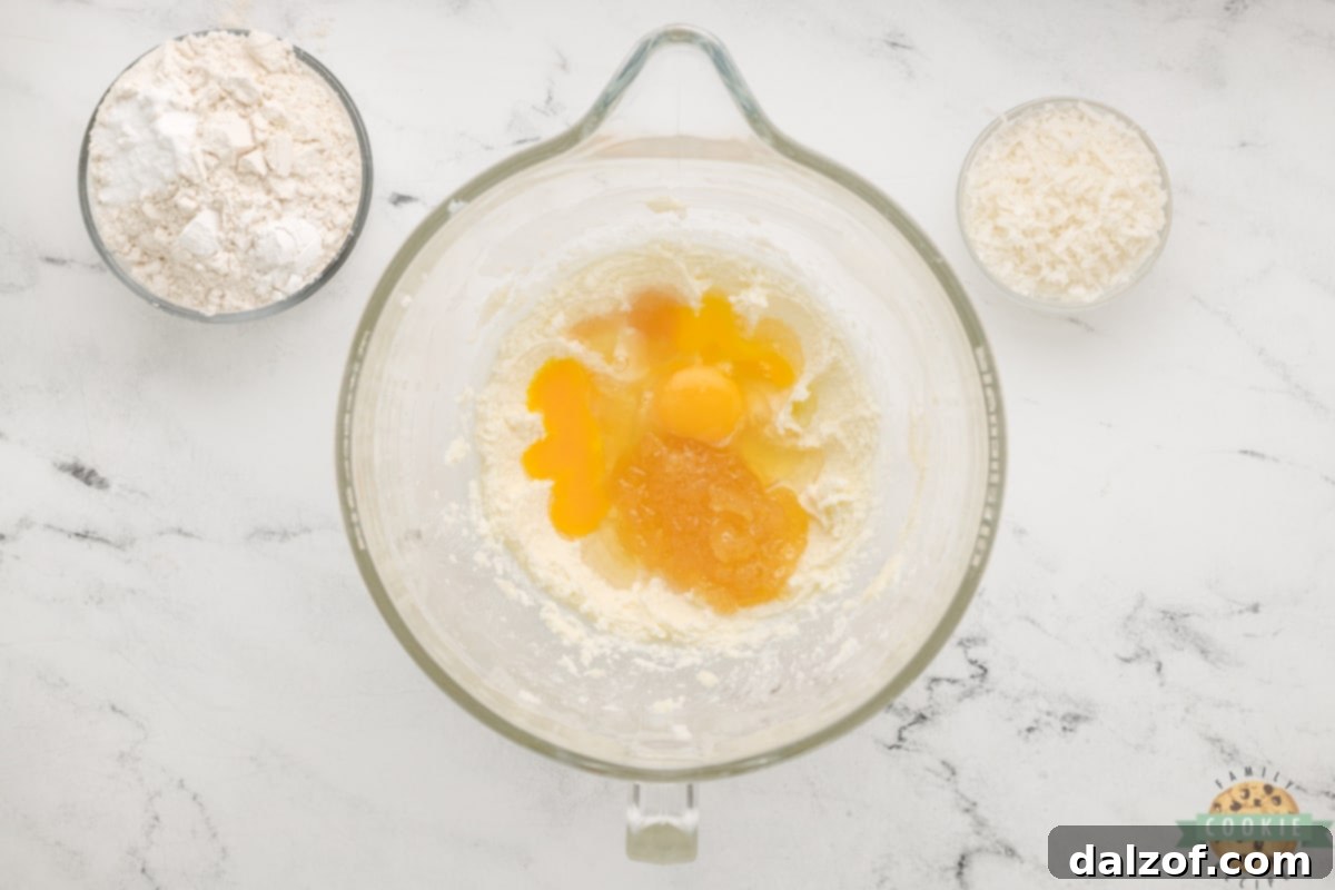 Add eggs and pineapple topping to creamed butter and sugar. 