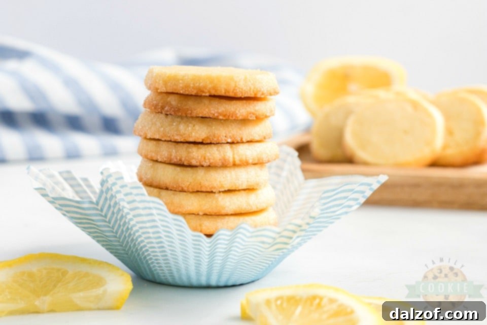 Delicious Lemon Slice and Bake Shortbread Cookies arranged on a cooling rack, showcasing their golden edges and delicate texture.