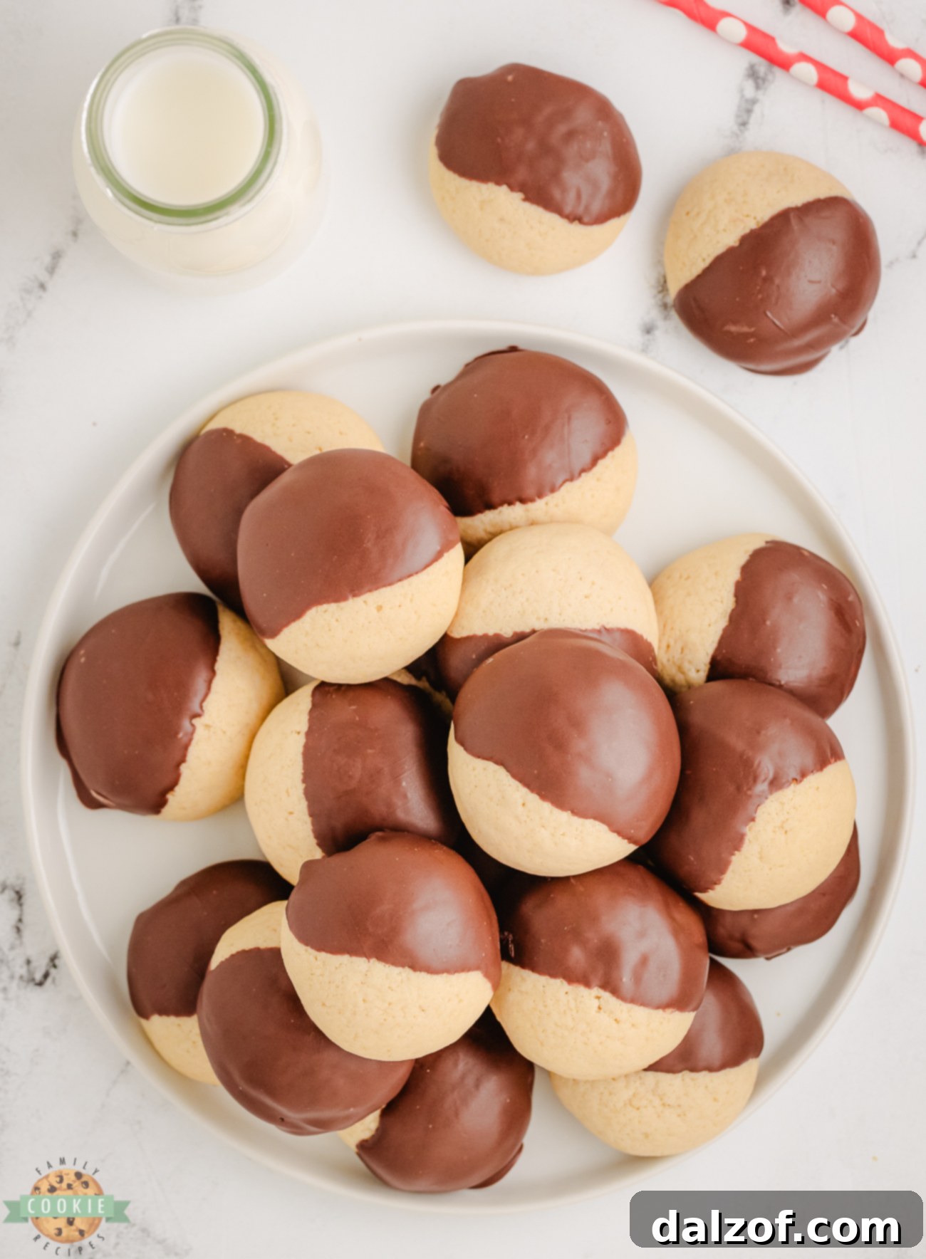 plateful of soft vanilla cookies dipped in chocolate