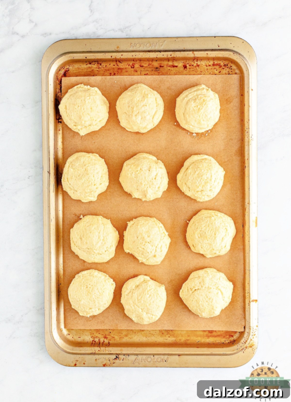 Crumbl-Inspired Golden Oreo Cookie Bliss 8 Dividing cookie dough into 12 sections.
