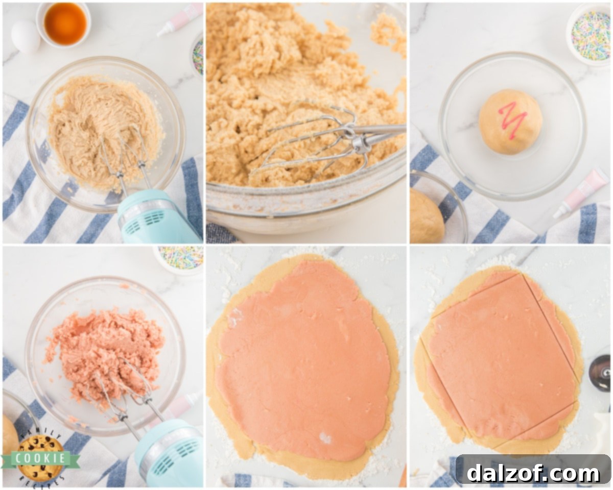 Two layers of cookie dough, one pink and one white, rolled flat and stacked on a floured surface, ready to be shaped into pinwheel cookies.