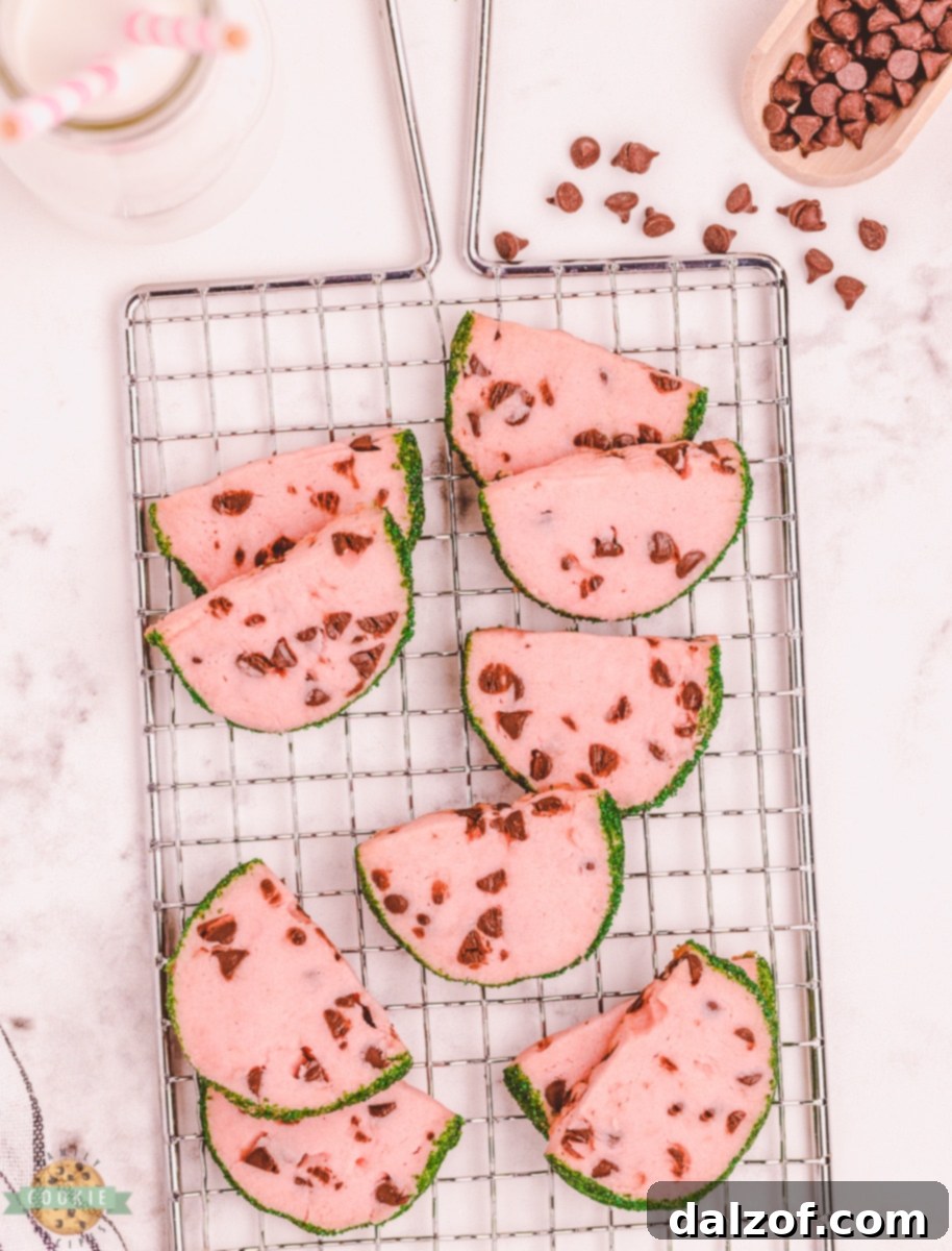 slice and bake butter cookies made to look like watermelon slices on a cooling rack