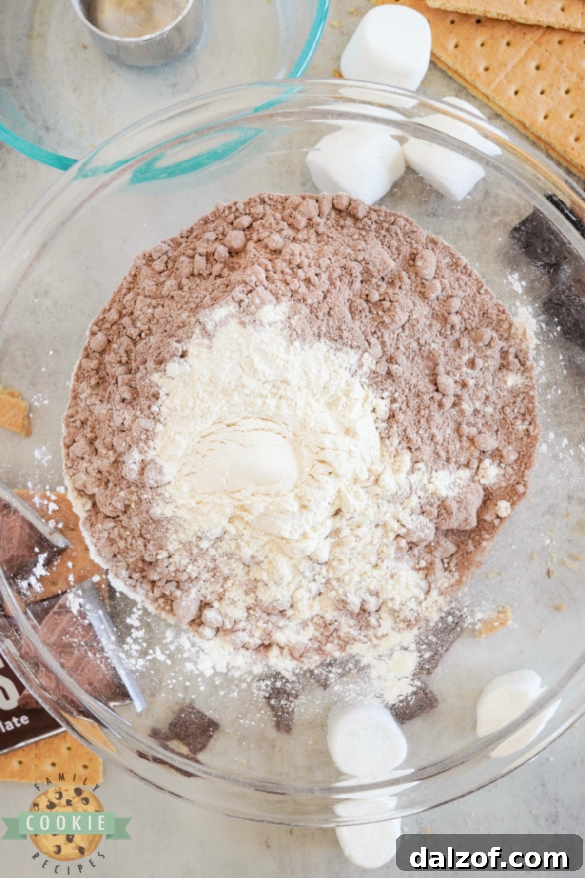 S'mores Brownie Mix Cookies 6 A large mixing bowl containing brownie mix and all-purpose flour, ready to be combined.