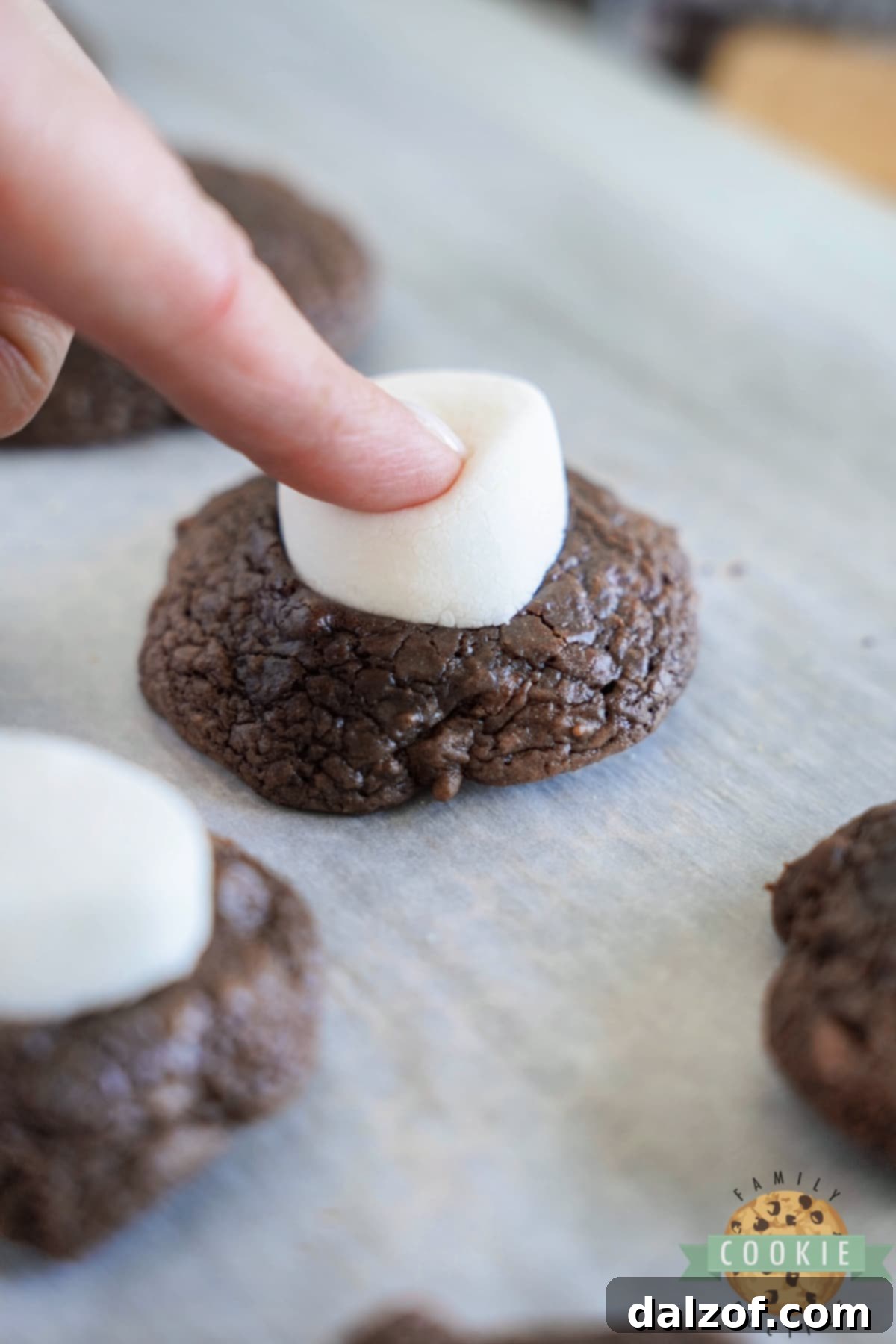 S'mores Brownie Mix Cookies 10 Placing a halved marshmallow, cut side down, onto the top of a warm chocolate cookie and gently pressing.