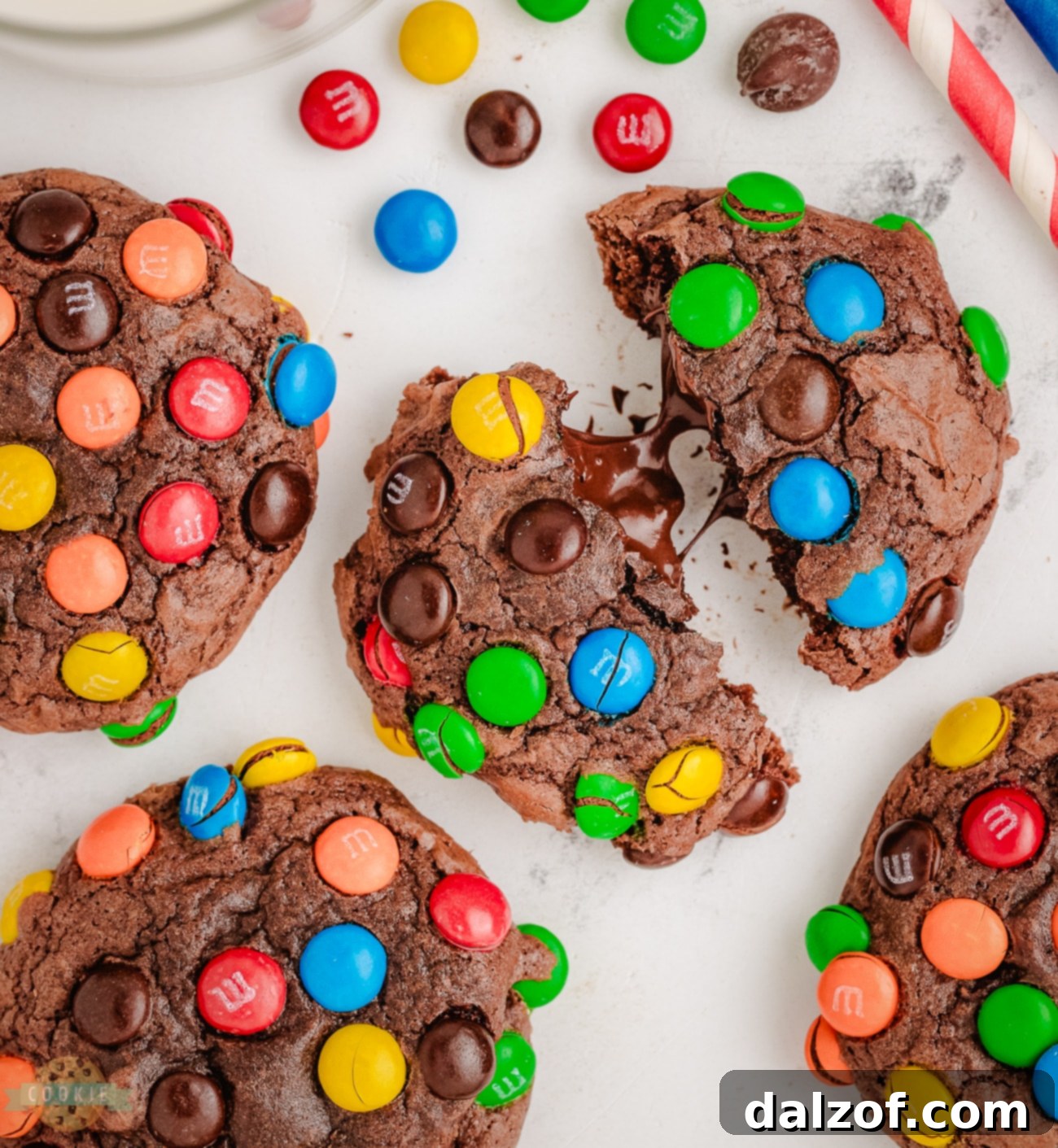 Close-up of gooey chocolate brownie mix cookies adorned with vibrant M&M candies, showcasing their rich texture.