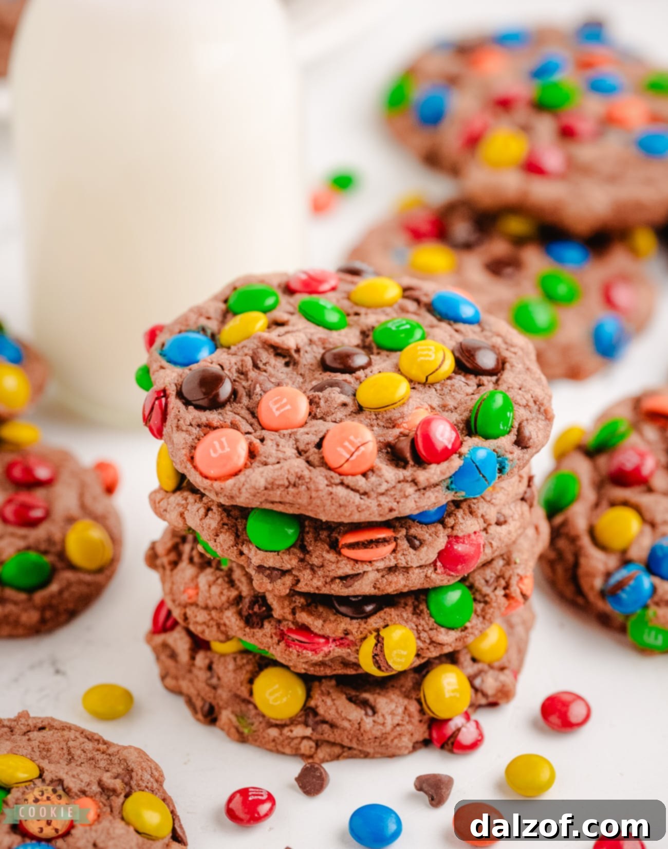 A beautiful stack of soft, chewy chocolate cookies made with chocolate pudding mix and topped with colorful M&M candies, ready to be enjoyed.