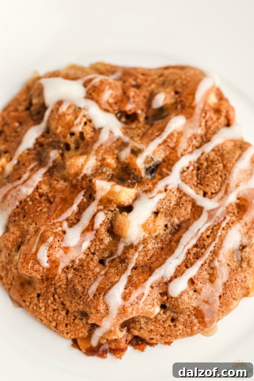 Close-up of a batch of homemade Spiced Apple Cookies, showing their soft texture and the glaze.
